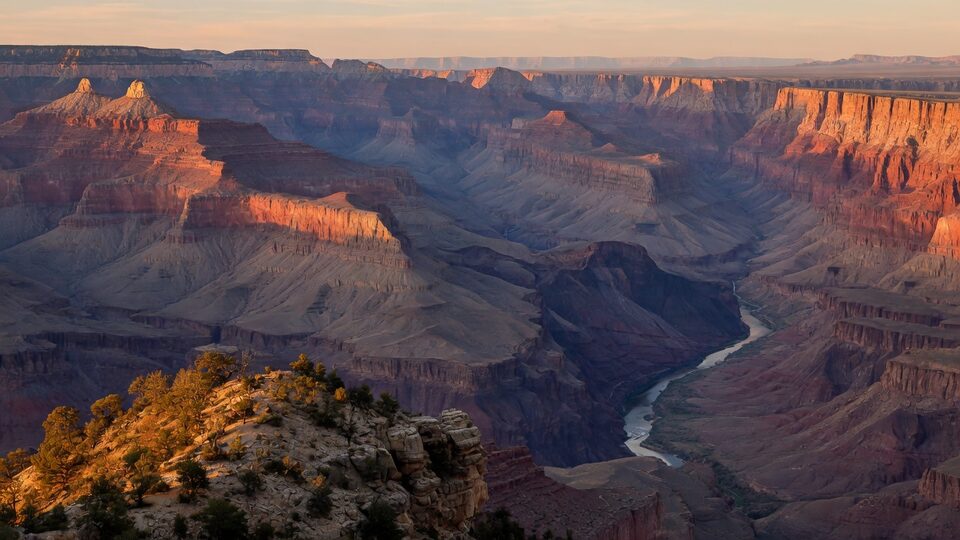 Grand Canyon South Rim at golden hour with the Colorado River far below