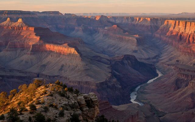 Grand Canyon South Rim at golden hour with the Colorado River far below