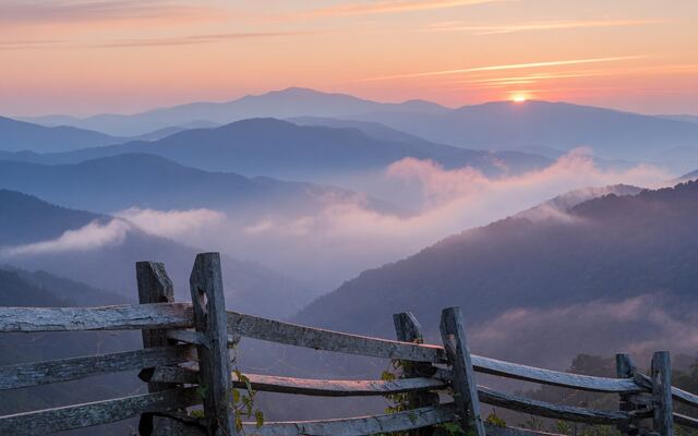 Misty blue ridges of the Great Smoky Mountains at sunrise
